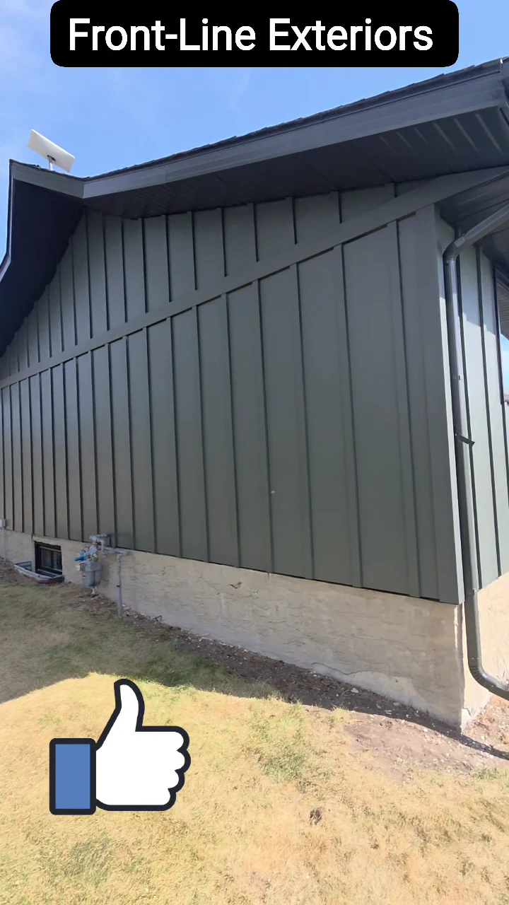 Charcoal Hardie board-and-batten siding and dark roofline around the deck