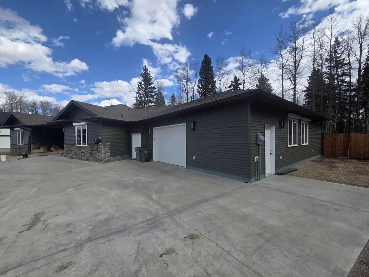 Coordinated siding and trim around the attached garage and front entrance