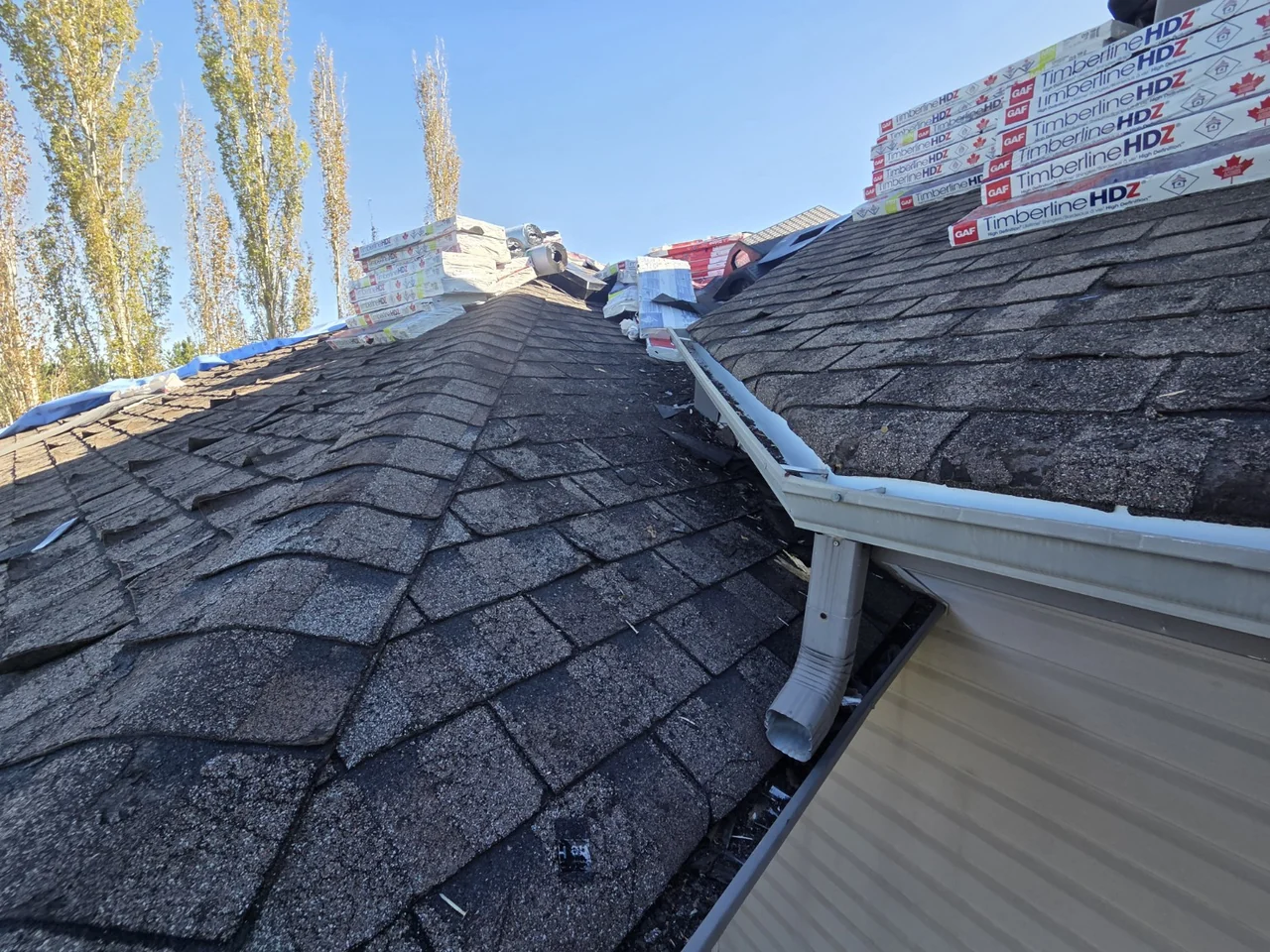 Roofing work in progress at an eave and roof junction