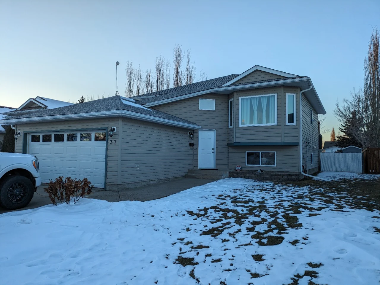 The same house after the soffit, fascia and eavestrough renovation