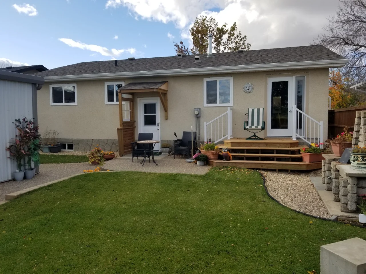 Original rear stucco exterior and deck before the vinyl renovation
