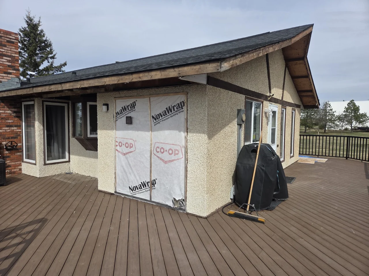 Wall preparation and house wrap during the stucco-to-Hardie renovation